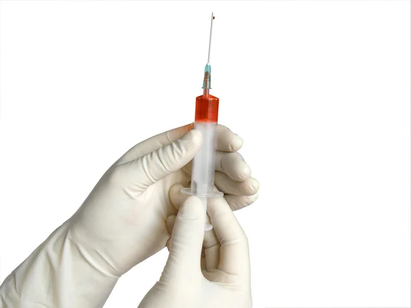 Syringe in hand — Stock Photo, Image