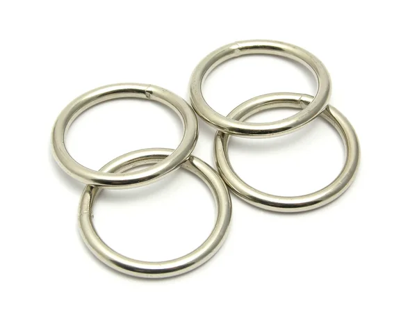 Quatro anéis de metal dispostos — Fotografia de Stock