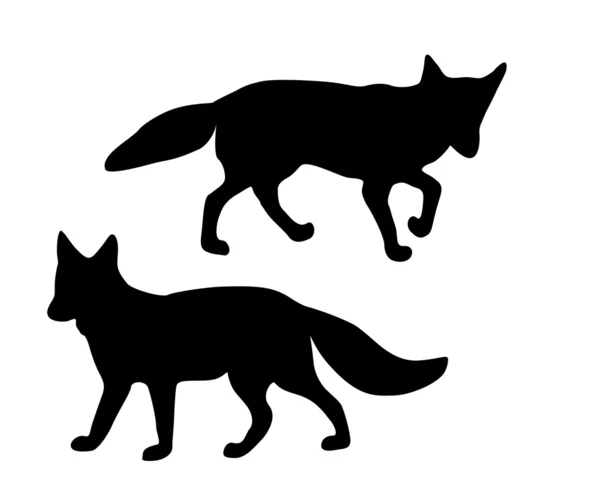 As silhuetas pretas de duas raposas em wh — Fotografia de Stock