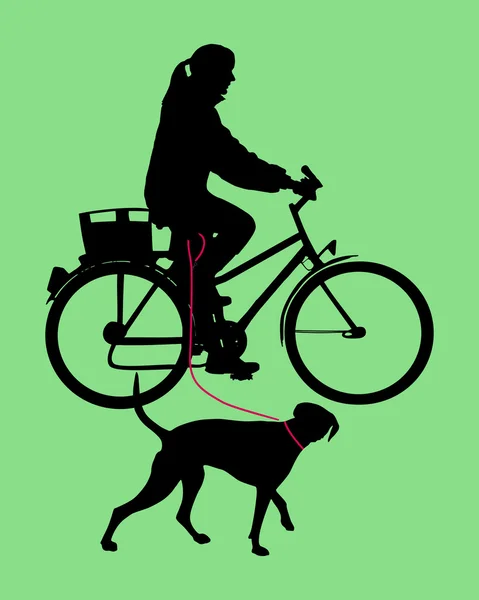 Kobieta na rowerze z psem na smyczy — Zdjęcie stockowe