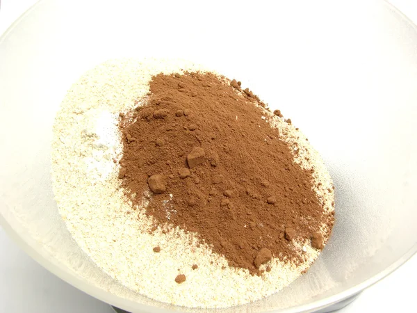 Repas, cacao et levure chimique sur une cuisse — Photo