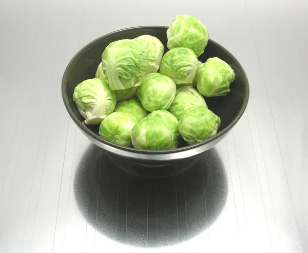 Bowl of chinaware with brussels sprouts — Stock Photo, Image