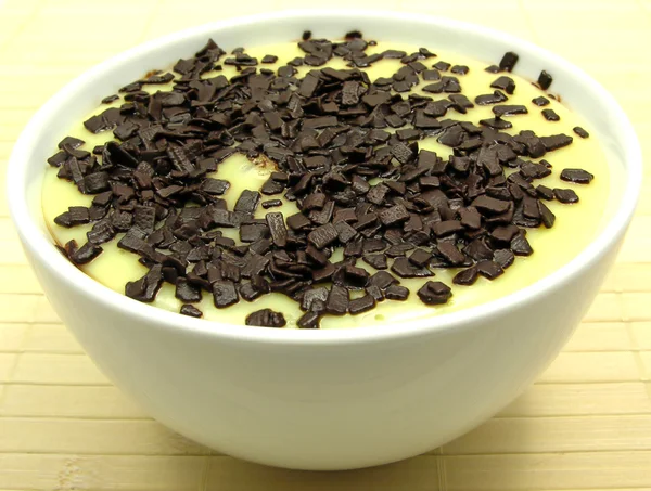 Custard with grated chocolate in a bowl — Stock Photo, Image