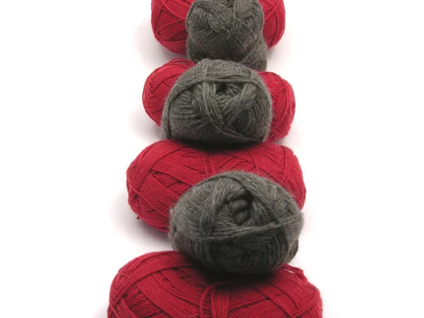 Gray and red new wool as midline on whit — Stock Photo, Image