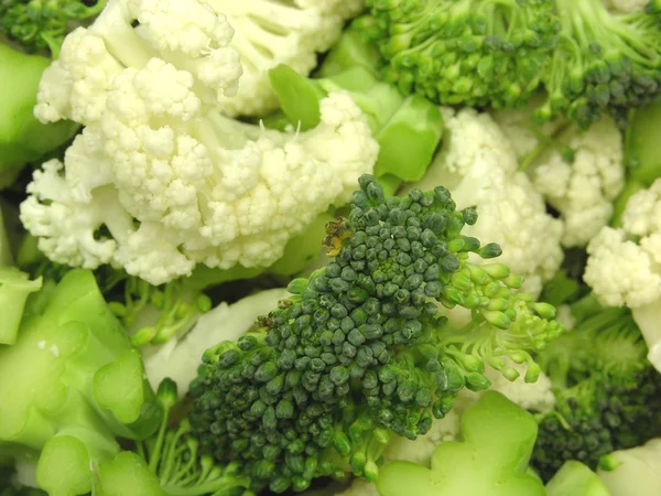 Cauliflower and broccoli mixed as a back — Stock Photo, Image