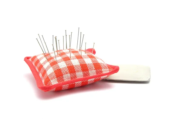 Pin cushion with pins and chalk — Stock Photo, Image