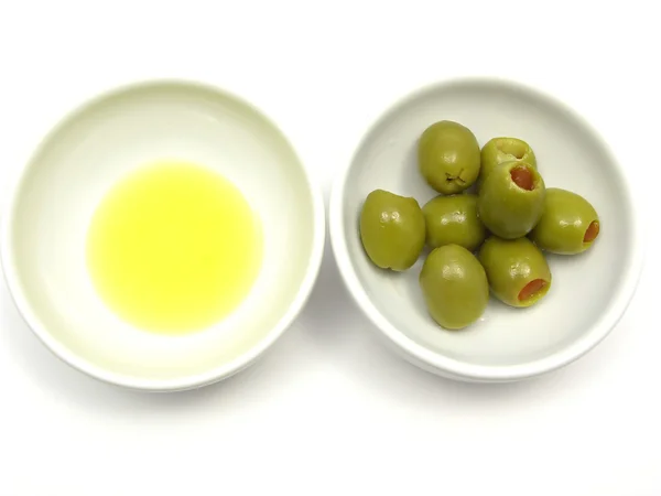 Two bowls of chinaware with olive oil an — Stock Photo, Image
