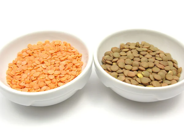 Two bowls of chinaware with lentils and — Stock Photo, Image