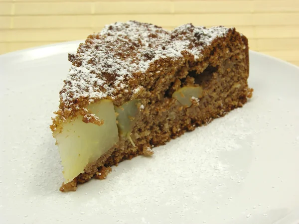 One slice of pear cake on a white plate Stock Photo