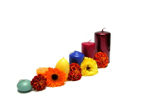 Six candles arranged with flowers — Stock Photo, Image