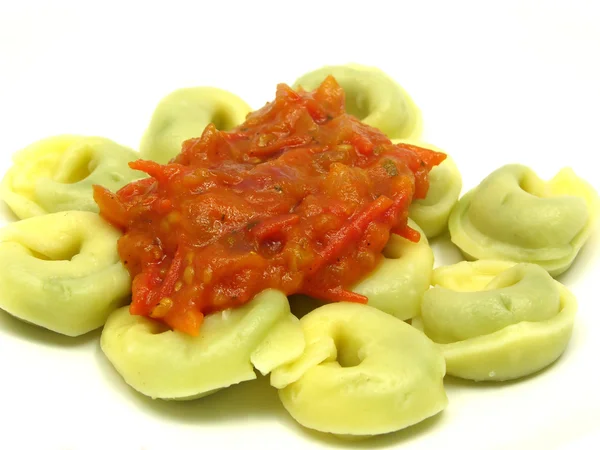 Stuffed noodles with tomato sauce — Stock Photo, Image