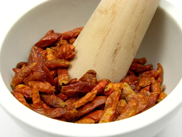 Pestling sušené red hot chili pepper — Stock fotografie