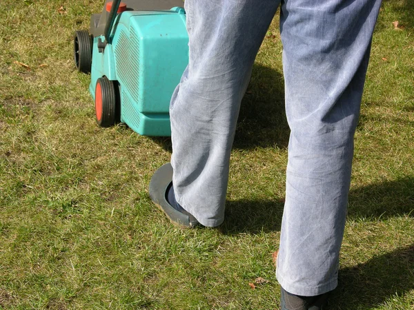 Cutout man with lawn mower — Stock Photo, Image