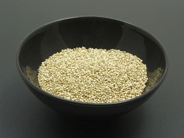 Quinoa on a dull matting — Stock Photo, Image