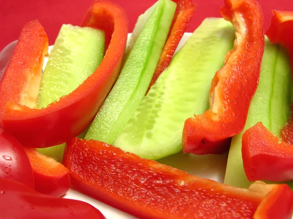 Slitted red pepper and cucumber — Stock Photo, Image