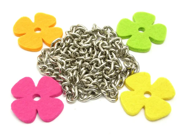 Flowers of felt fraiming a chain — Stock Photo, Image