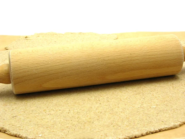 Wholemeal dough with a rolling pin — Stock Photo, Image