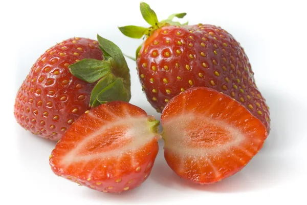 Two ripe strawberries and two segments — Stock Photo, Image