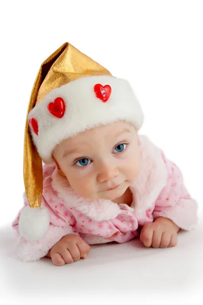 Criança bonita em chapéu de Natal — Fotografia de Stock