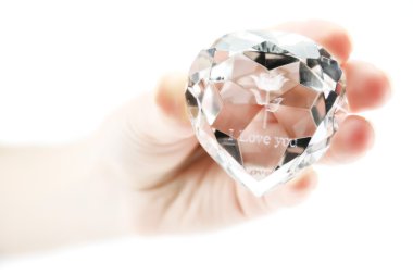 Women's hand holds crystal with declarat clipart