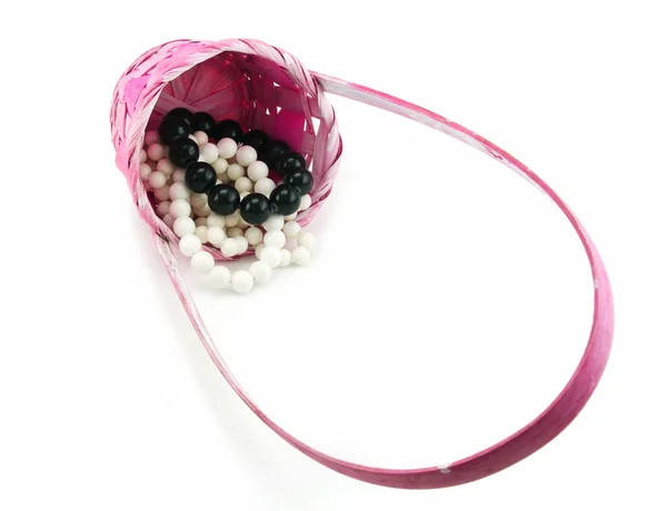 Barevné Perle v růžové proutěný pružin — Stock fotografie