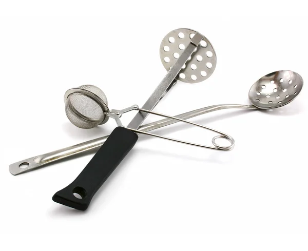 Two perforated spoons and tea strainer — Stock Photo, Image