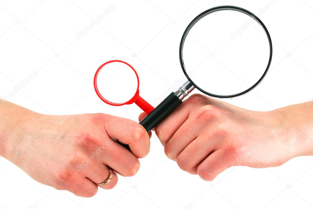 Woman's hands holds two magnifying glass