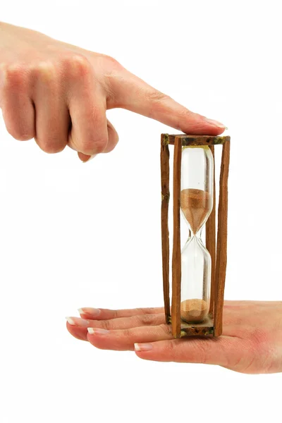 Female hand holds hourglass — Stock Photo, Image