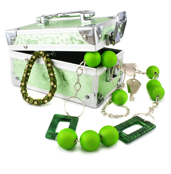 Light green trunk, beeads and armlet iso — Stock Photo, Image