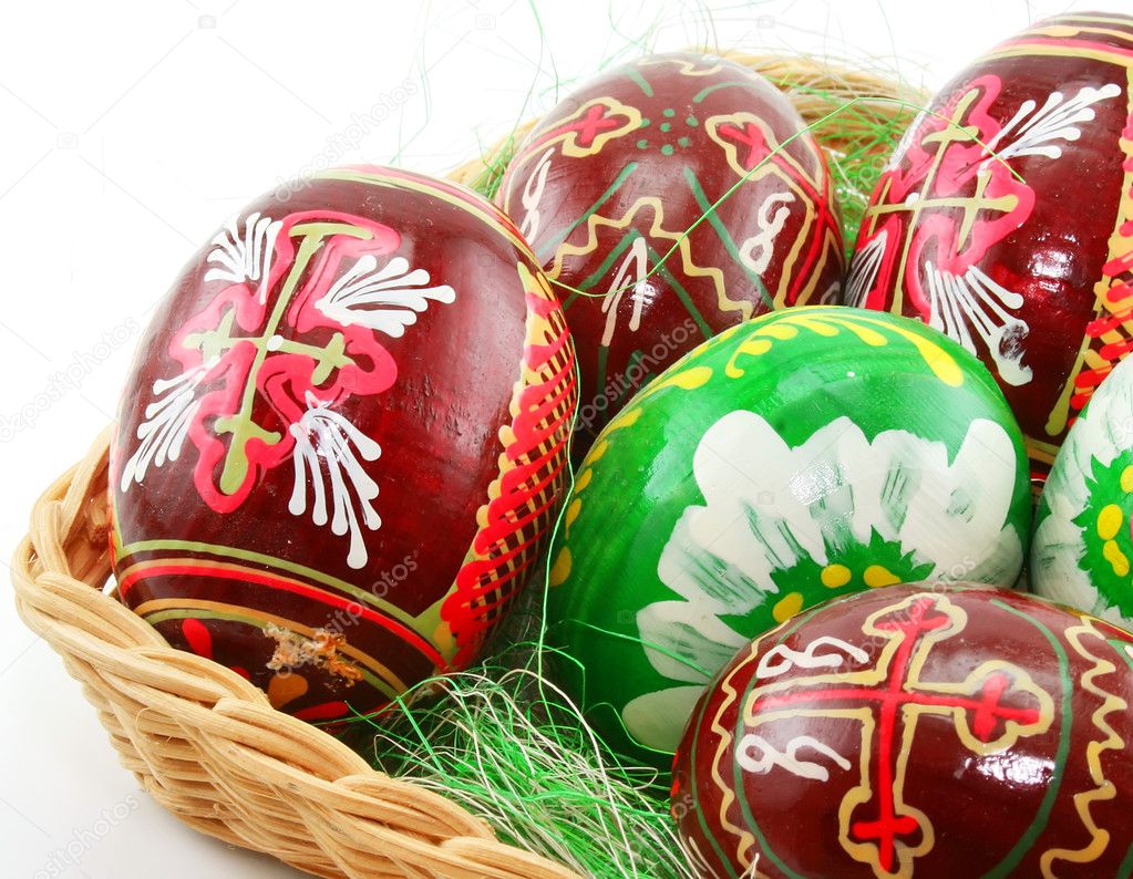 Group of painted Easter eggs in wooden b