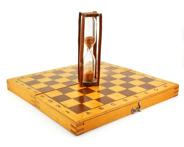 Sjakkbrett og timeglass – stockfoto