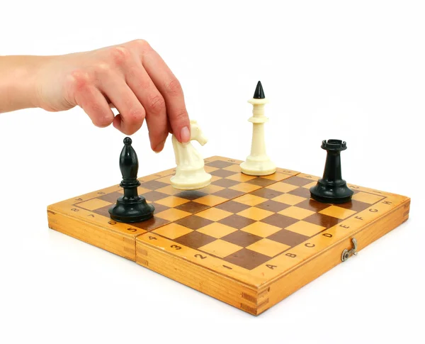 Chessboard and female hand gives check — Stock Photo, Image