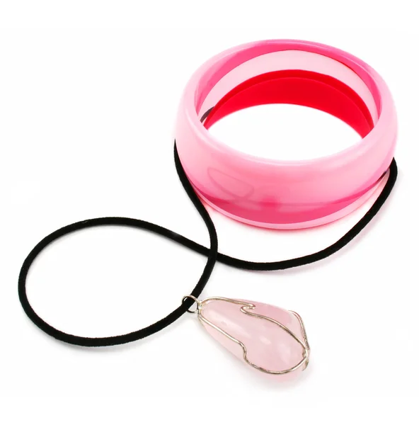 Pink bracelet and quartz pendent — Stock Photo, Image