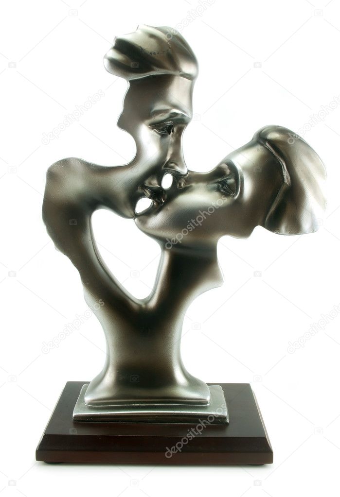 Statuette of man and woman kissing isolated
