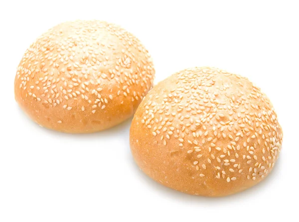 Two tasty baked rolls with sesame isolated — Stock Photo, Image