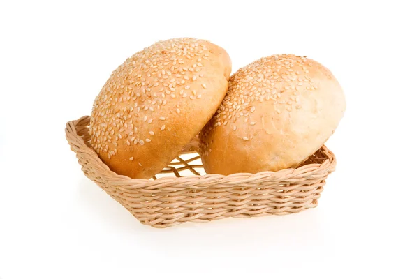 Two Baked Buns with Sesame in Basket — Stock Photo, Image