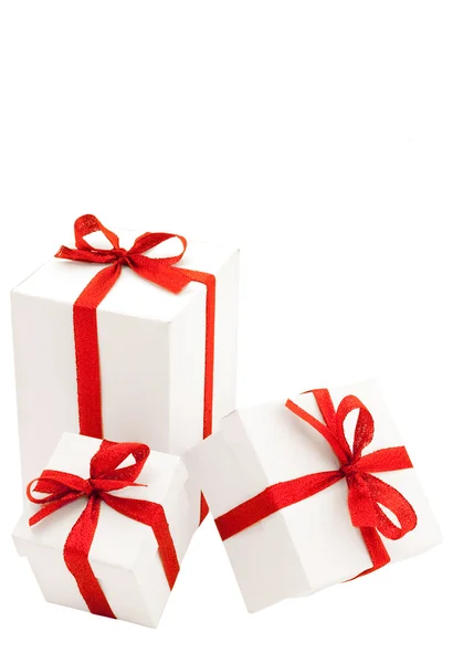 Three white boxes with red bows — Stock Photo, Image