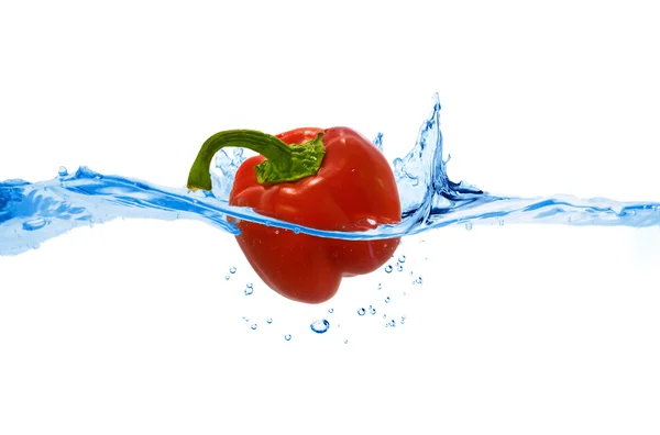 Sweet pepper thrown in the water — Stock Photo, Image