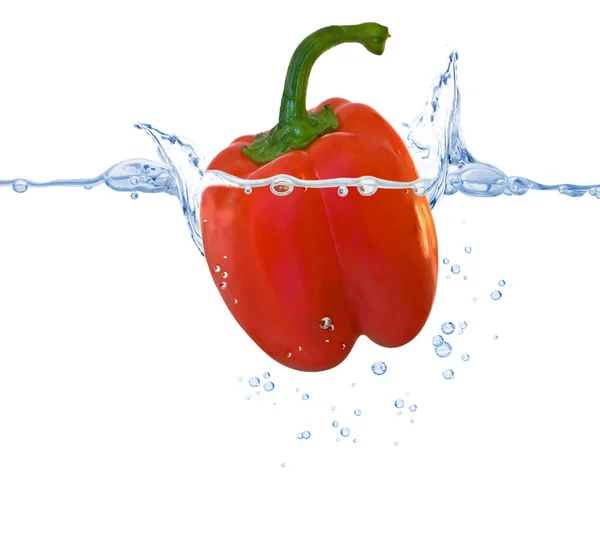 Sweet pepper thrown in the water — Stock Photo, Image