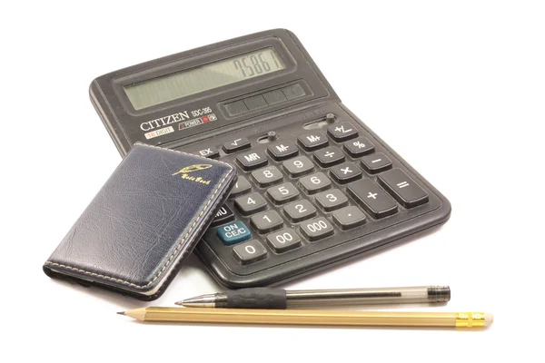 Калькулятор, блокнот, карандашная ручка Стоковая Картинка