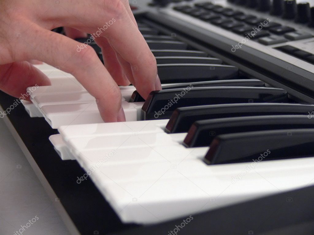 Human playing on piano