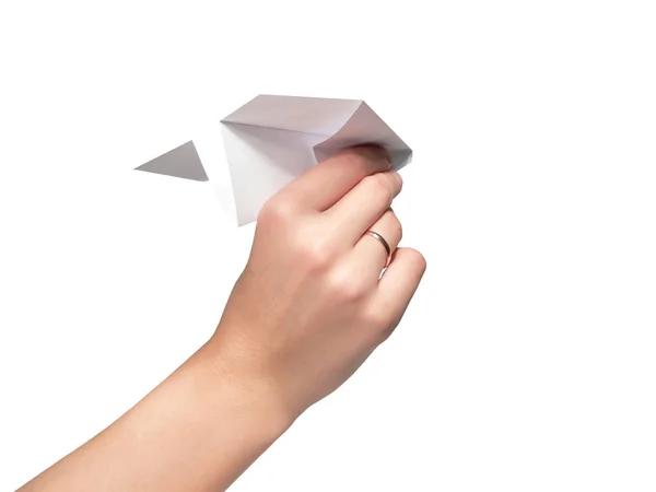 Weibliche Hand startet den Papierflieger — Stockfoto
