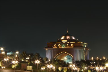 East wing gate of Emirates Palace. Night clipart