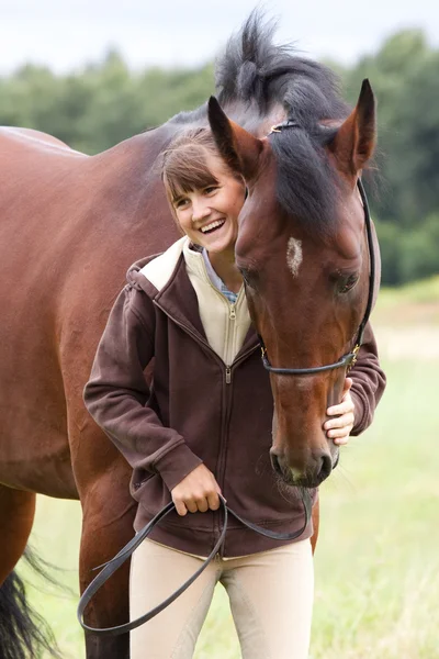 Inseparable - young girl and bay horse — Stock Photo, Image