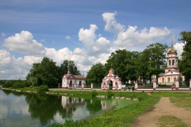 Church on river bank clipart