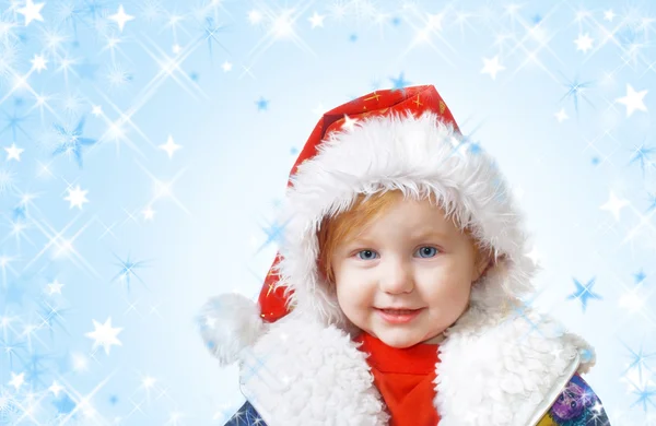 Kind mit roten Weihnachtsmützen — Stockfoto