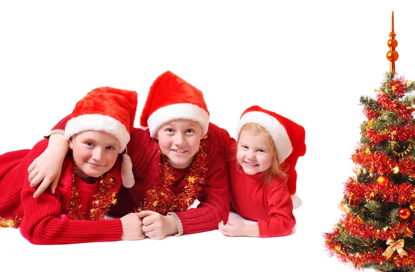 Children in red christmas hats — Stock Photo, Image