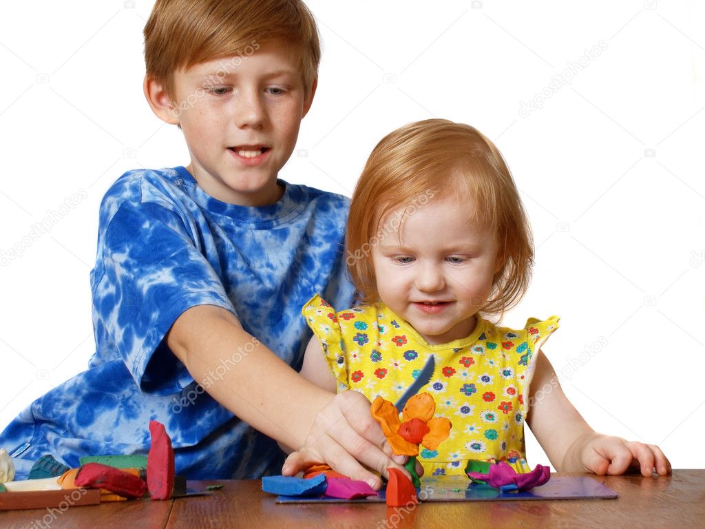 Boy and girl with plasticine