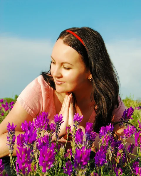 stock image The beautiful young woman in the field o