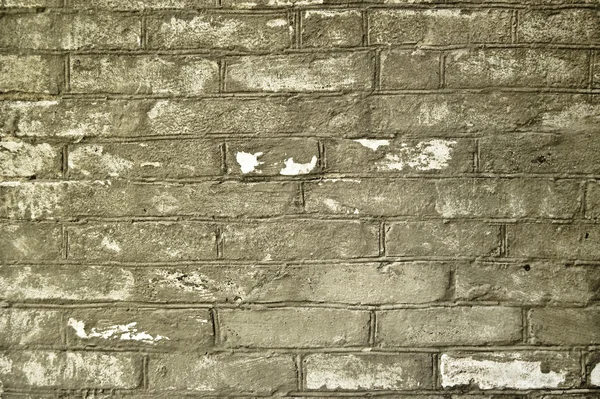 Oude grijze bakstenen muur — Stockfoto